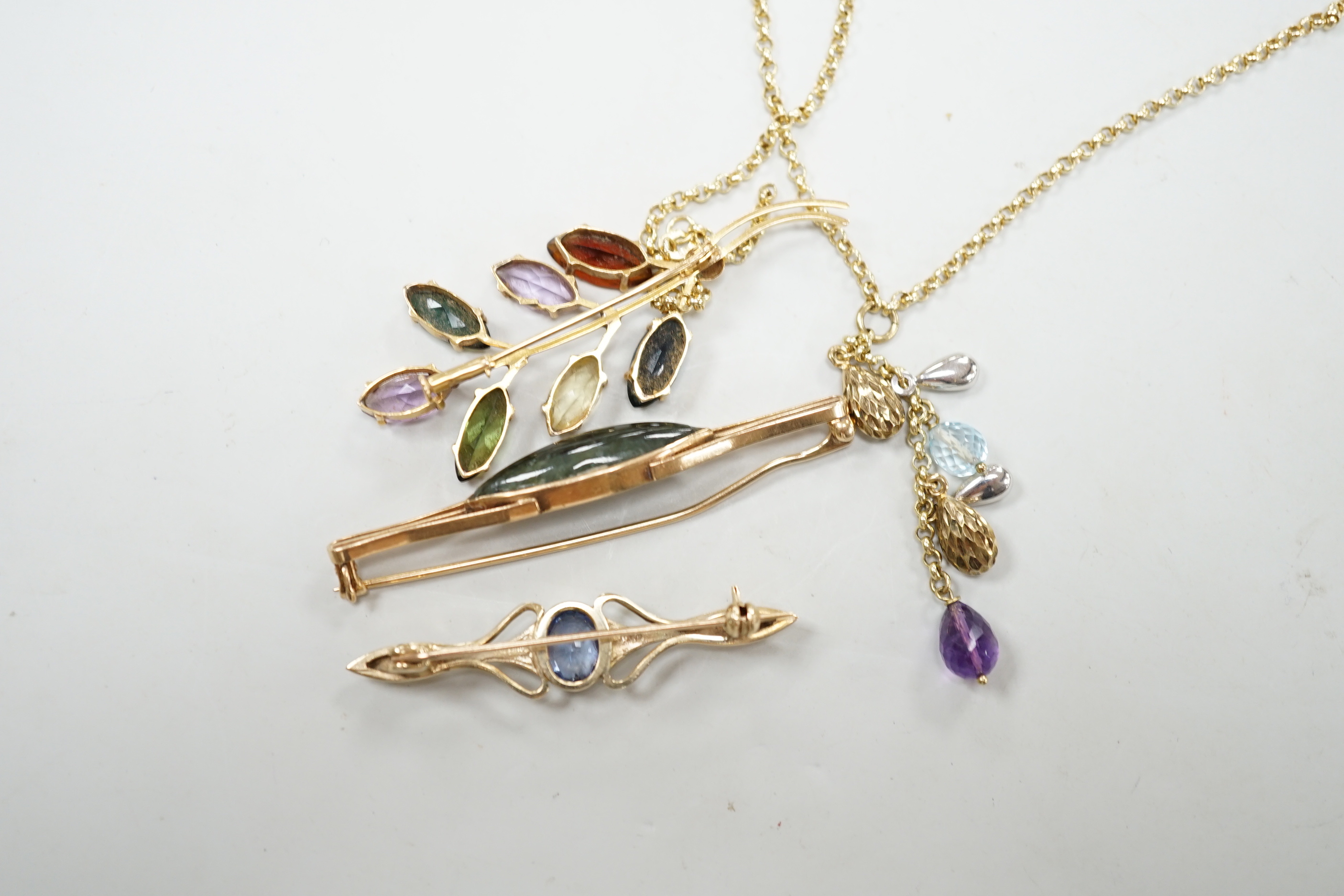 Three modern yellow metal and gen set brooches including 9ct gold and a modern 9ct gold and gem set necklace, gross weight 16.8 grams.